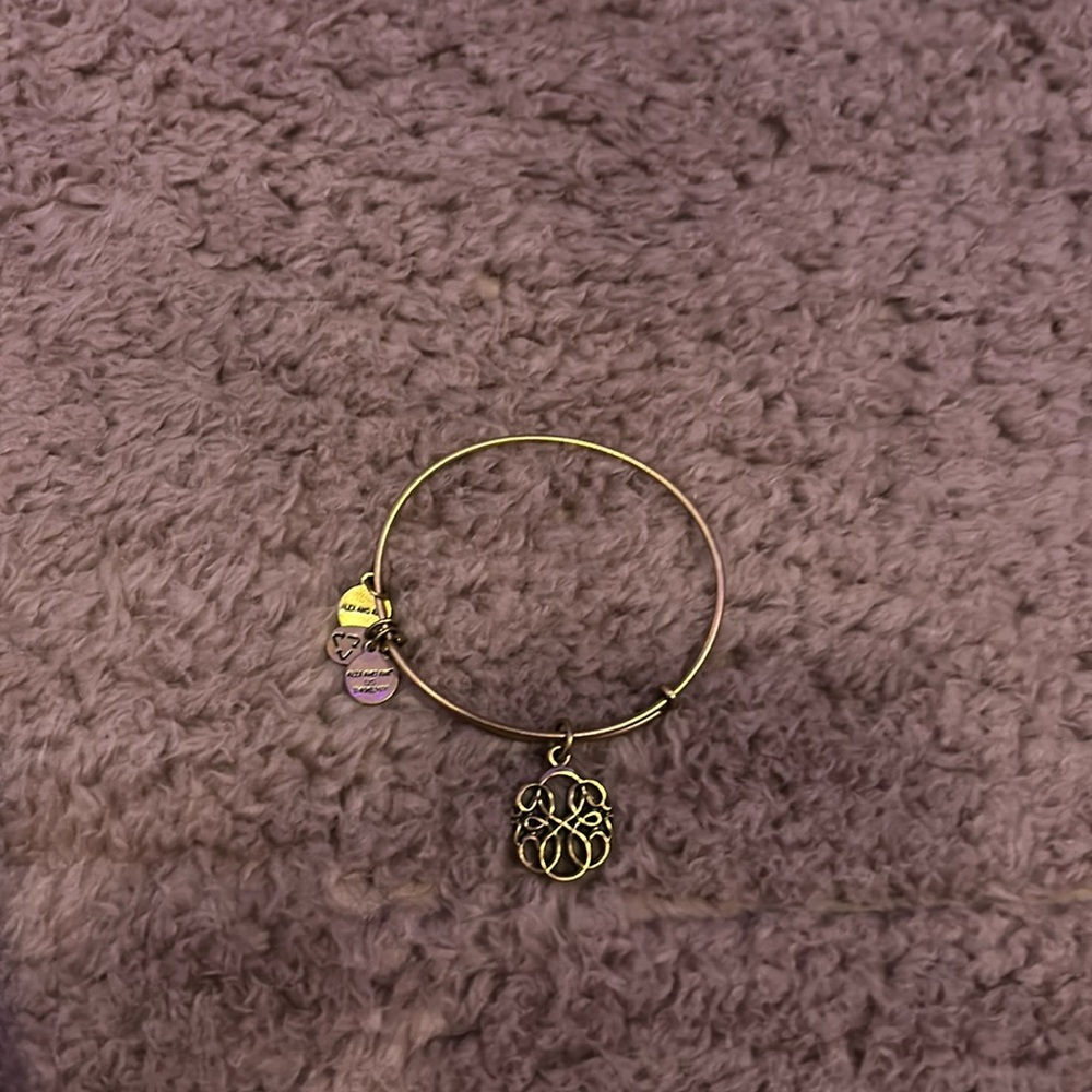 Alex & Ani gold bracelet with charm